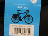 a label on the back of a bag with a bike on it