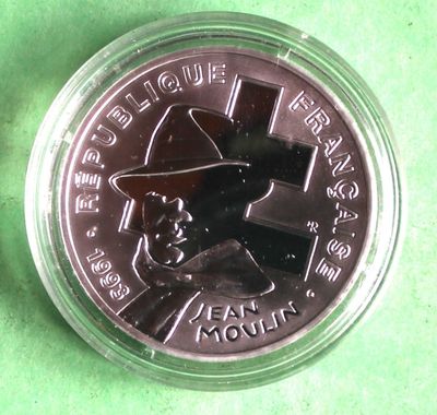 a close up of a coin with a picture of a man in a hat on it