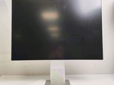 a computer monitor sitting on top of a white desk