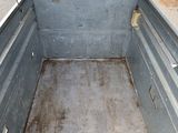 an image of an empty truck bed in the back of a truck