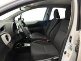 the interior of a car with the door open showing the driver ' s seat area