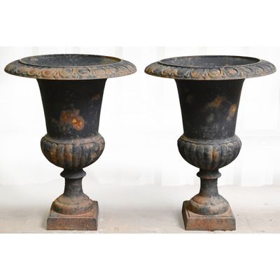 two vases sitting on top of each other on a table