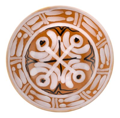 a plate with a design on it on a white background