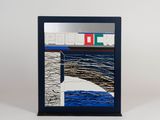 a picture of a mirror with a picture of a boat on it