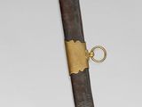 these are two swords with gold and black designs on them
