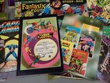 a lot of comic books on the table
