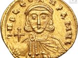 a gold coin with an image of jesus on it