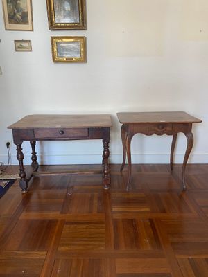 two tables that are sitting on a hard wood floor