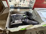 a box with a tie and other items inside of it