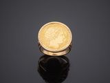a gold coin ring with a profile of a woman ' s head