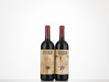 two bottles of red wine sitting on top of a table