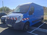 a blue van that is parked in a parking lot