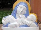 a statue of a woman holding a baby in her arms