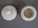 a white bowl and a white bowl on a table