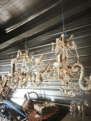 a chandelier hanging from the ceiling in a room