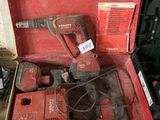 a red tool box with tools in it on the floor