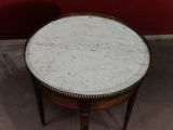 a marble top table with a metal frame around it