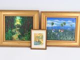 trois tableaux accrochés au mur l'un à côté de l'autre