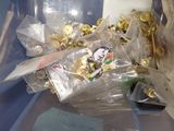 a pile of chocolates in a plastic container on a table