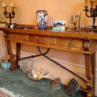 a wooden table with a clock on top of it