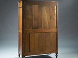 an old wooden cabinet with two doors on one side and a drawer on the other