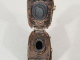 a small metal object with a hole in it