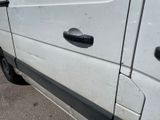 a white van that is parked on the side of the road
