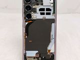 a close up of the back of a phone with a broken battery