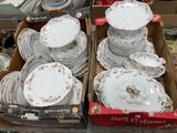 many plates and bowls in a box on the table