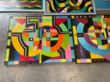 four pieces of art that are on a table in a room