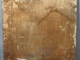 a close up of a piece of wood with writing on it