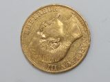 an image of a gold coin with a picture of a woman on it