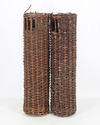 pair of wicker vases on a white background with a white background