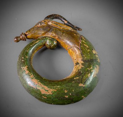 a close up of a sculpture of a snake on a ring