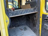 a yellow truck that has a door open and the door is open