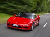 a red car that is driving down the road