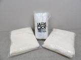 three bags of toilet paper sitting on a table