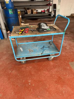 a blue cart with tools on it in a garage