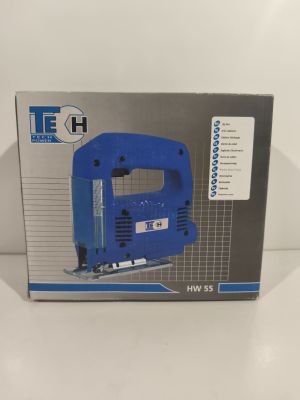 the box is open to show the contents of the electric jig saw