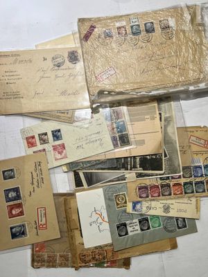 many different types of stamps and envelopes laid out on a table