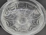 a clear glass plate with a circular design on it