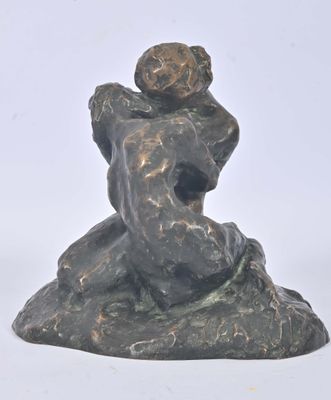 statue of a woman holding a child on her shoulders