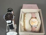 deux montres et un bracelet dans une boîte posée sur une table