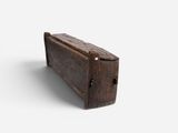 an old suitcase sitting on a white surface