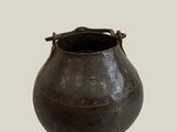 a black pot that is sitting on a table