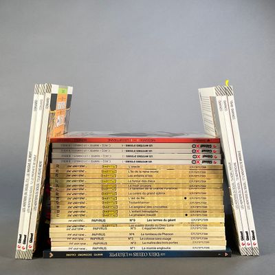 a lot of books stacked on top of each other