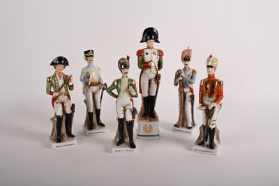 five figurines of men dressed in military uniforms