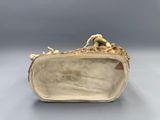 an image of a close up of a purse on a table