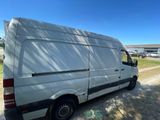 a white van that is parked on the side of the road