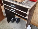 a box sitting on top of a desk next to a pair of shoes